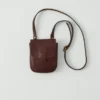 Kate Sheridan Leder-Tasche mit halbkreisförmigen Laschen Kate Sheridan Leder-Tasche mit halbkreisförmigen Laschen